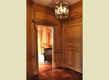 Pine panelled hallway and doors with carved architraves and pediment, Knightsbridge, London